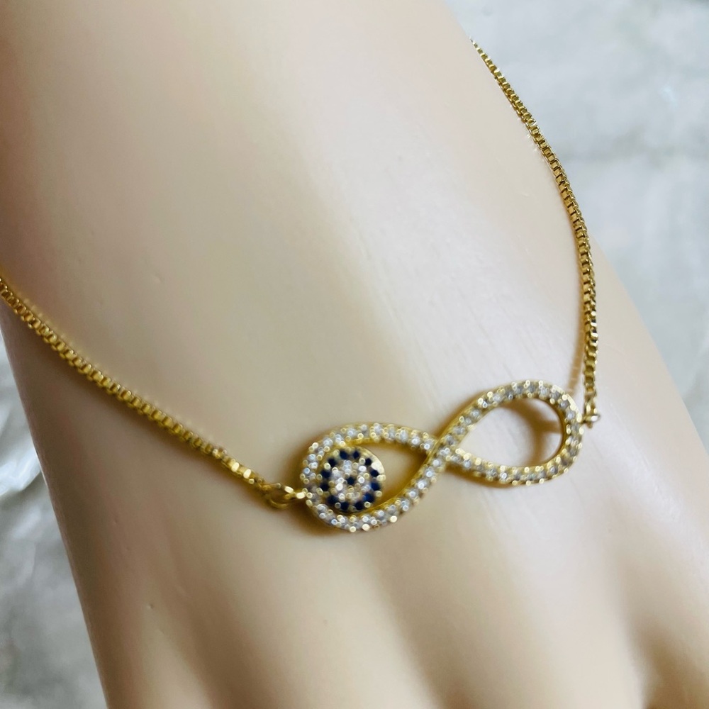 9.5in Oro laminado 18K Gold Infinity Evil Eye Bracelet w/ Clear and Black Stone - Picture 2 of 4